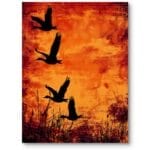 Plakat do salonu industrialnego ptaki na tle pomarańczowego zachodu czarno-pomarańczowy