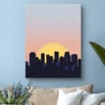 Plakat do salonu zachód słońca nad miastem