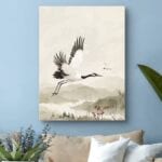 Obraz do salonu żuraw w locie nad krajobrazem